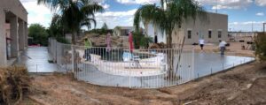 A pool with people standing around it