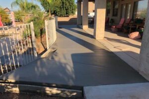 A driveway with a ramp going up to the top of it.