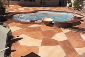 A pool with a large tile pattern on the ground.