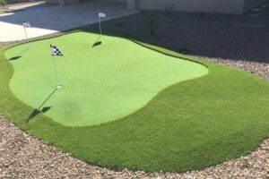 A golf course with a flag on the green.