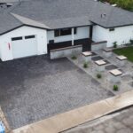 A house with a driveway and a patio in it