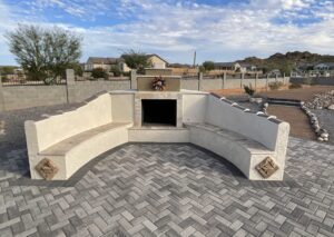 A fire place sitting in the middle of an outdoor patio.