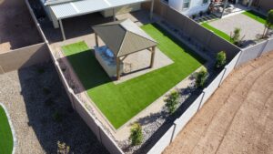 A gazebo and some grass in an outdoor area.