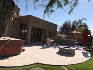 A patio with fire pit and seating area.