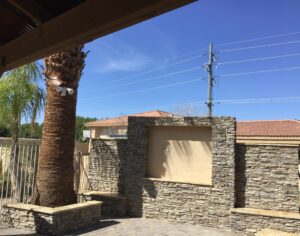 A palm tree is in the background of this outdoor area.